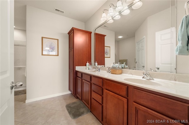 bathroom with tile patterned flooring and vanity