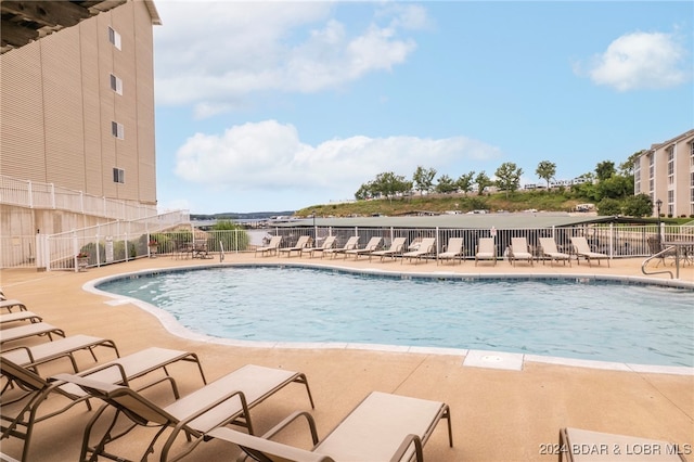 view of swimming pool with a patio area