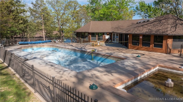 view of pool featuring a patio