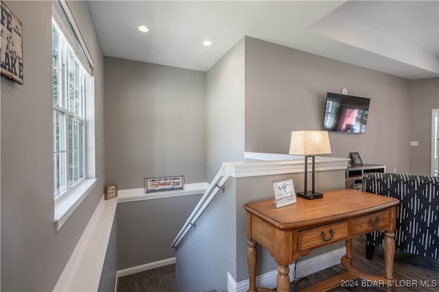 office space with dark wood-type flooring