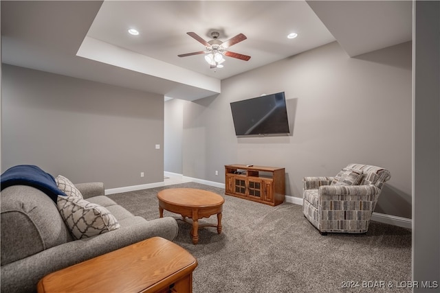 living room featuring carpet flooring and ceiling fan