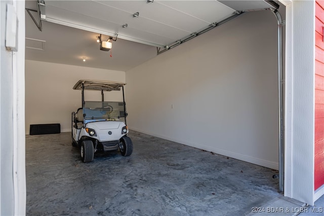 garage featuring a garage door opener