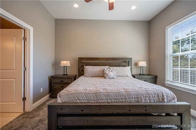 carpeted bedroom with ceiling fan