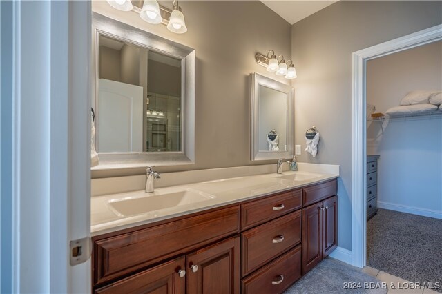 bathroom with vanity and tile patterned flooring