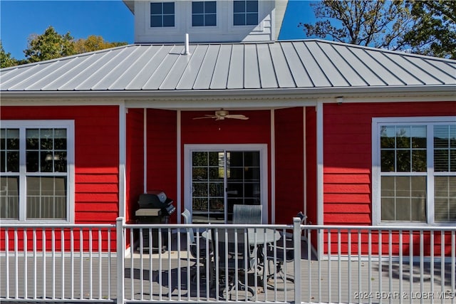 entrance to property featuring ceiling fan