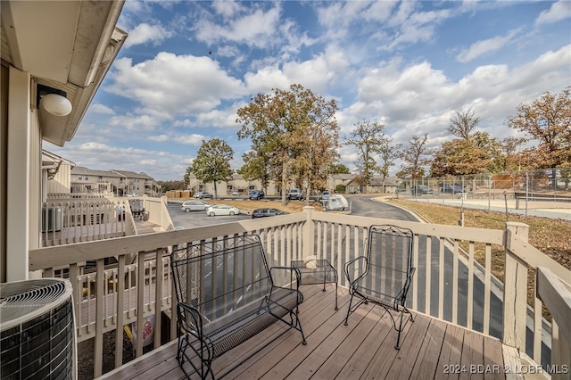 wooden deck featuring central air condition unit