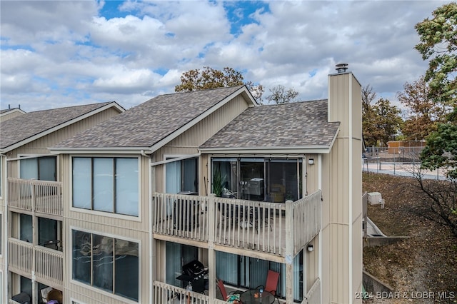 back of property featuring a balcony