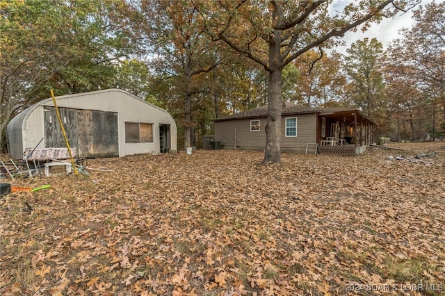 back of house featuring cooling unit