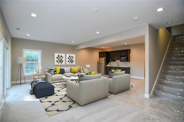 living room with stairs, recessed lighting, visible vents, and baseboards