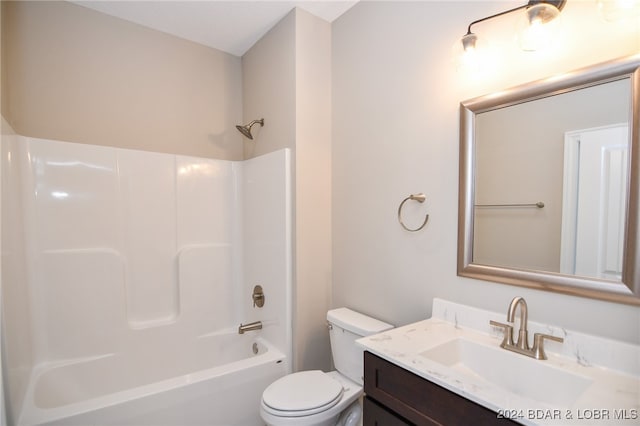 bathroom with  shower combination, vanity, and toilet