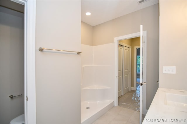 bathroom with vanity and walk in shower