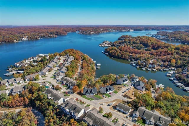 aerial view with a water view, a forest view, and a residential view