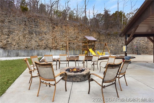 view of patio with an outdoor fire pit