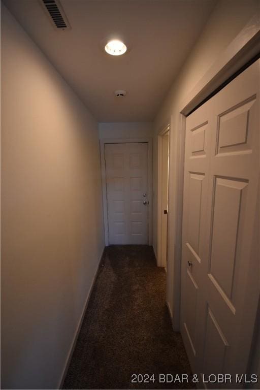 corridor with dark carpet