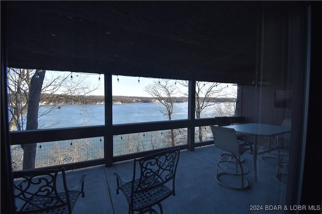 balcony featuring a water view