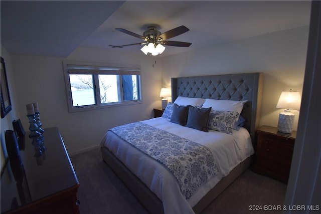 bedroom with dark colored carpet and ceiling fan