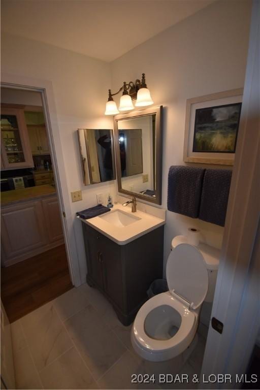 bathroom with vanity and toilet