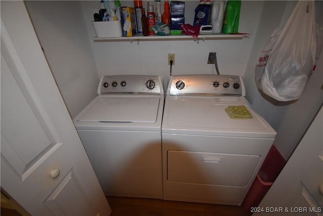 clothes washing area with washer and clothes dryer