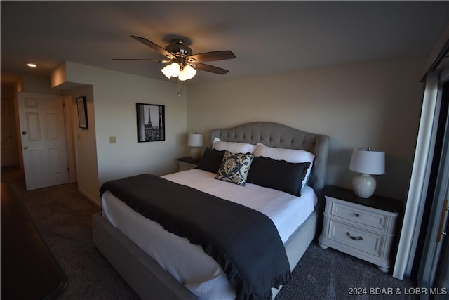 bedroom featuring dark carpet and ceiling fan