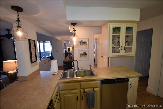 kitchen featuring pendant lighting, dishwasher, sink, and cream cabinetry