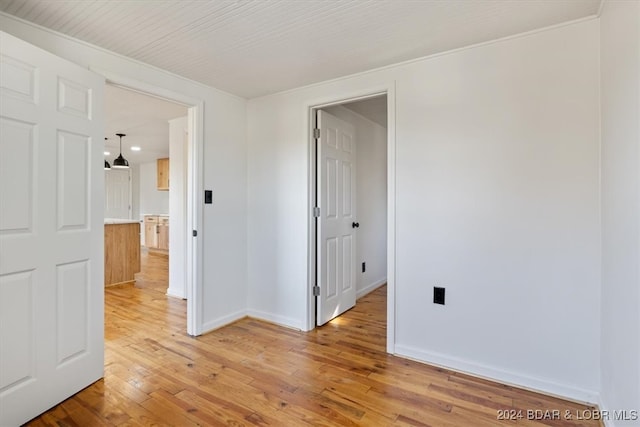 spare room with hardwood / wood-style floors