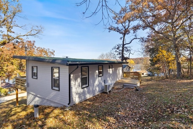 view of side of property with ac unit