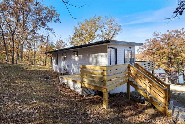 rear view of property with a deck