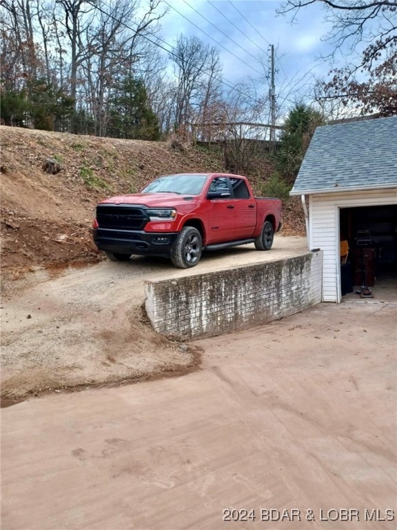 view of parking with a garage