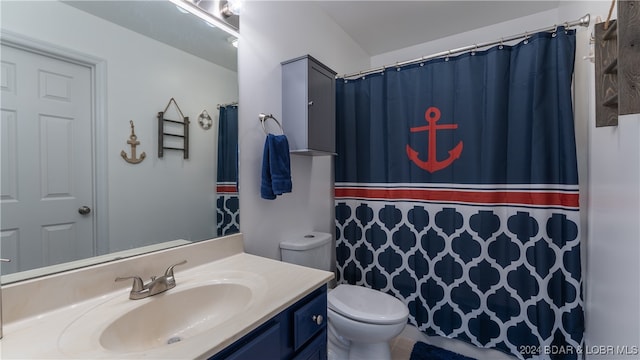 bathroom featuring vanity and toilet