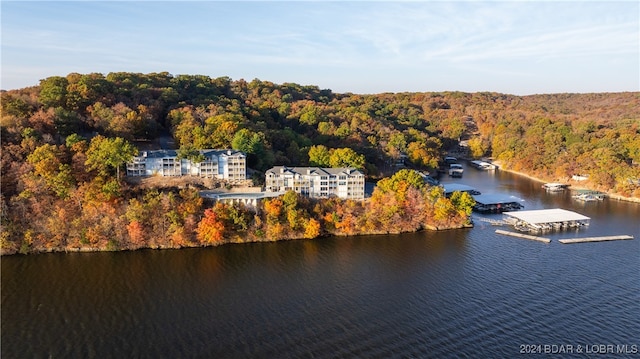 birds eye view of property with a water view