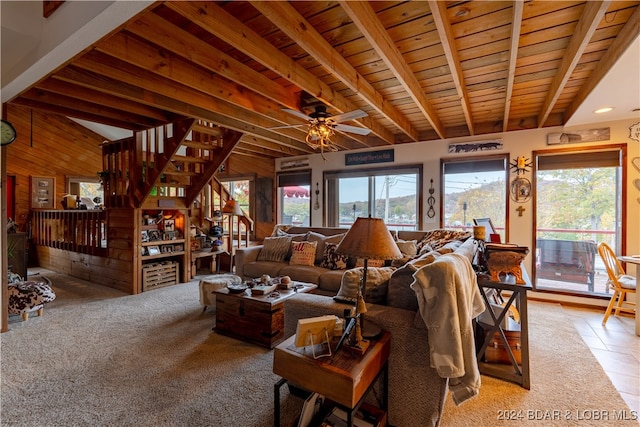 living room with wooden walls, ceiling fan, wooden ceiling, and light tile patterned floors