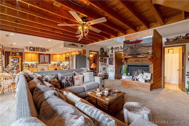 living room featuring light carpet, wood ceiling, beamed ceiling, and ceiling fan