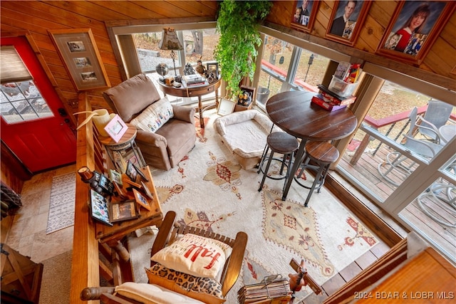 living room with wood walls