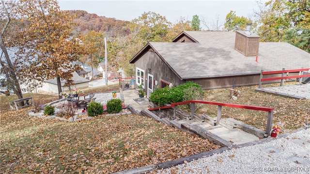 view of property exterior with a mountain view