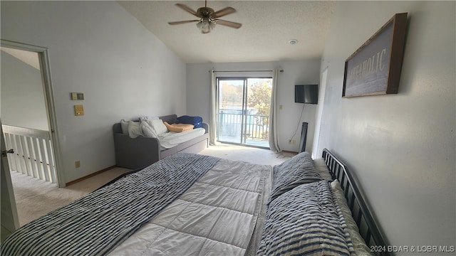 bedroom featuring access to exterior, light carpet, a textured ceiling, ceiling fan, and lofted ceiling