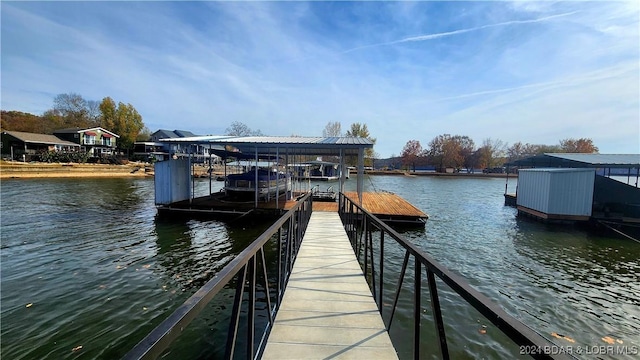 dock area featuring a water view and boat lift