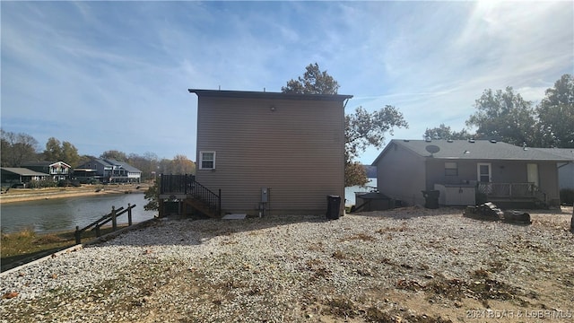 view of home's exterior with a water view