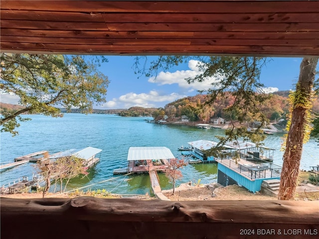 view of dock featuring a water and mountain view