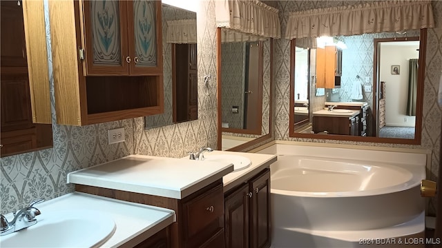 bathroom featuring vanity and a tub