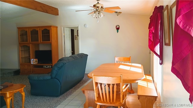 tiled dining area featuring lofted ceiling with beams and ceiling fan