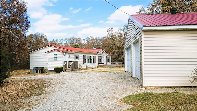 back of house with a garage