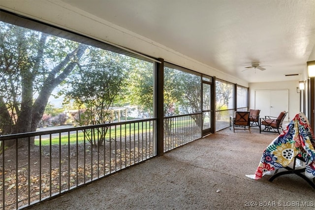 sunroom featuring ceiling fan