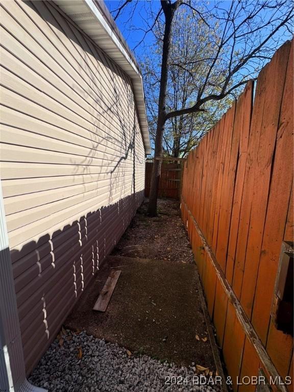 view of side of home featuring a fenced backyard