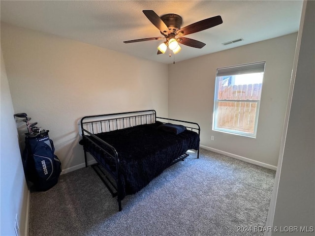 bedroom with visible vents, carpet, ceiling fan, and baseboards