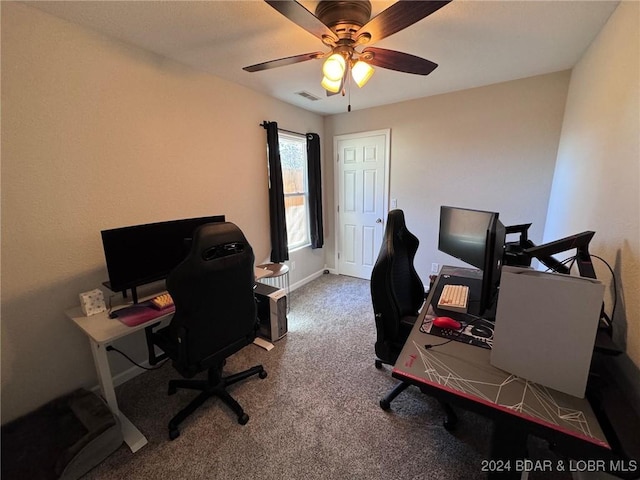 office with visible vents, a ceiling fan, and carpet floors