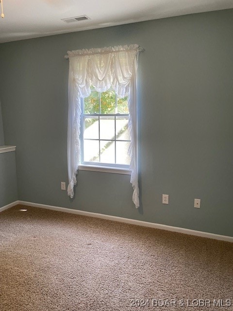 empty room featuring carpet flooring