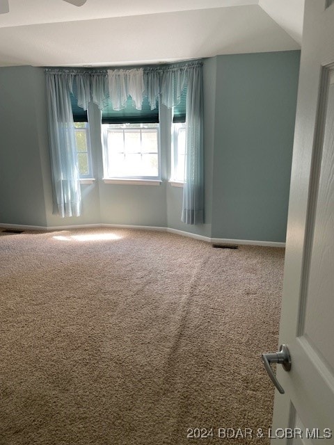 empty room featuring carpet flooring