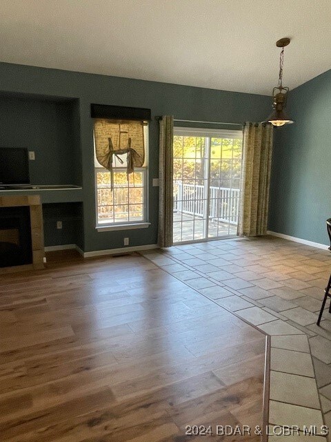 unfurnished living room featuring hardwood / wood-style flooring