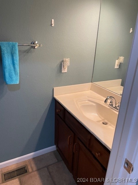 bathroom featuring vanity and tile patterned flooring