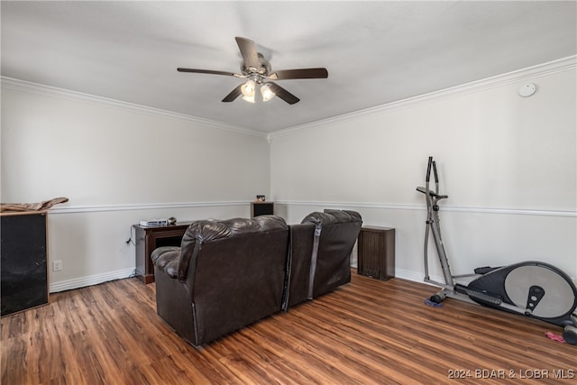 cinema featuring ornamental molding, dark hardwood / wood-style floors, and ceiling fan